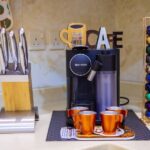 Nespresso machine with pods and cups