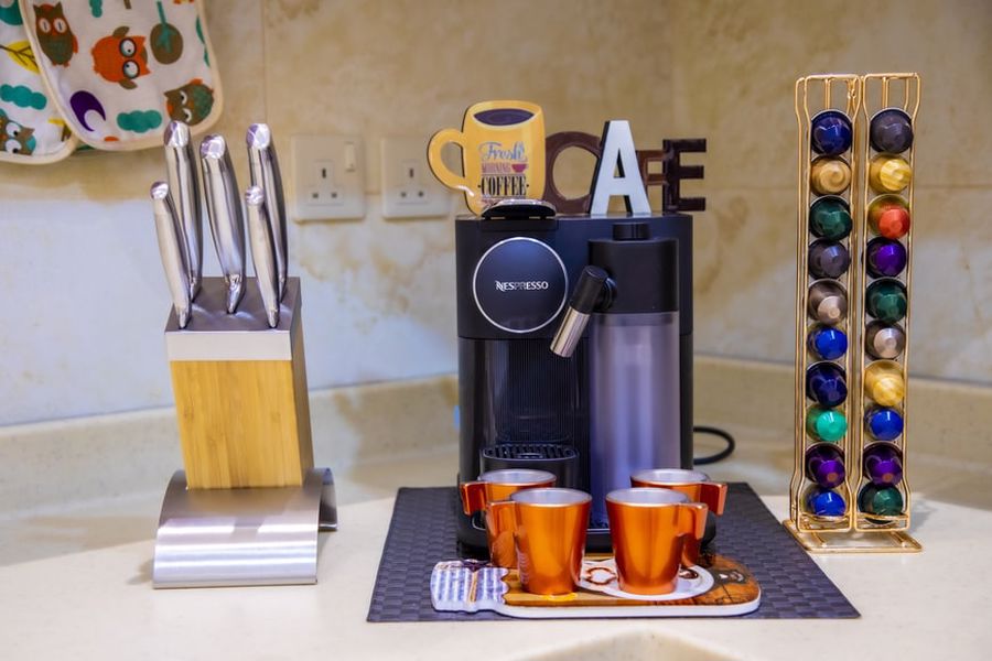 Nespresso machine with pods and cups