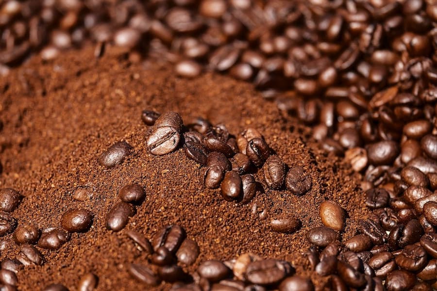 an image of coffee grounds and coffee beans