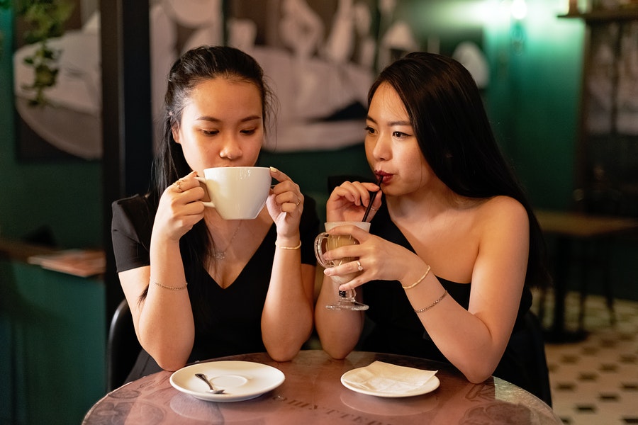 Couple of woman drinking coffee