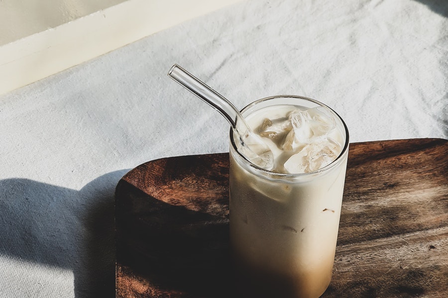 Ived latte in a glass with a straw