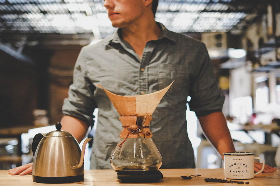 A man deciding what size Chemex to get