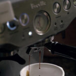A breville coffee machine brewing coffee