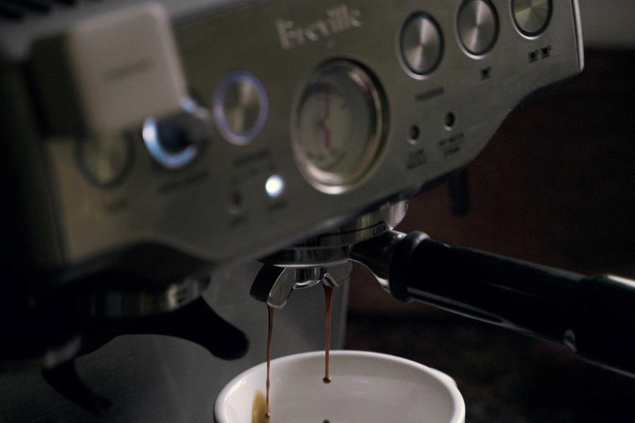 A breville coffee machine brewing coffee