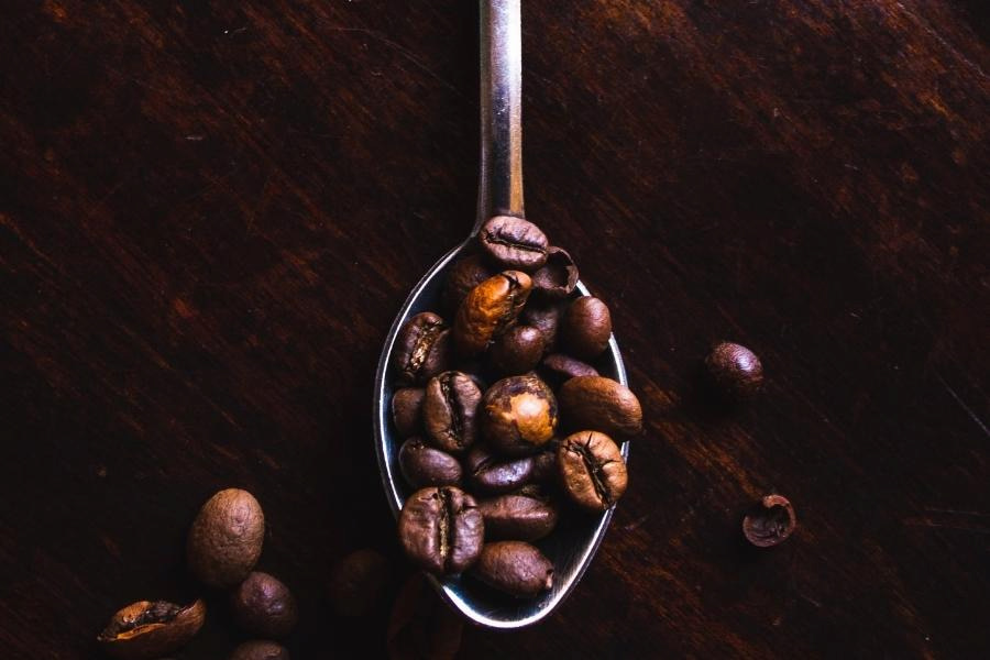 An image of spoonful coffee beans