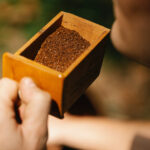 An image of coffee grounds in a wooden box